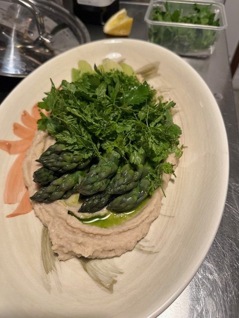 Asparagus and chervil over tahini purée